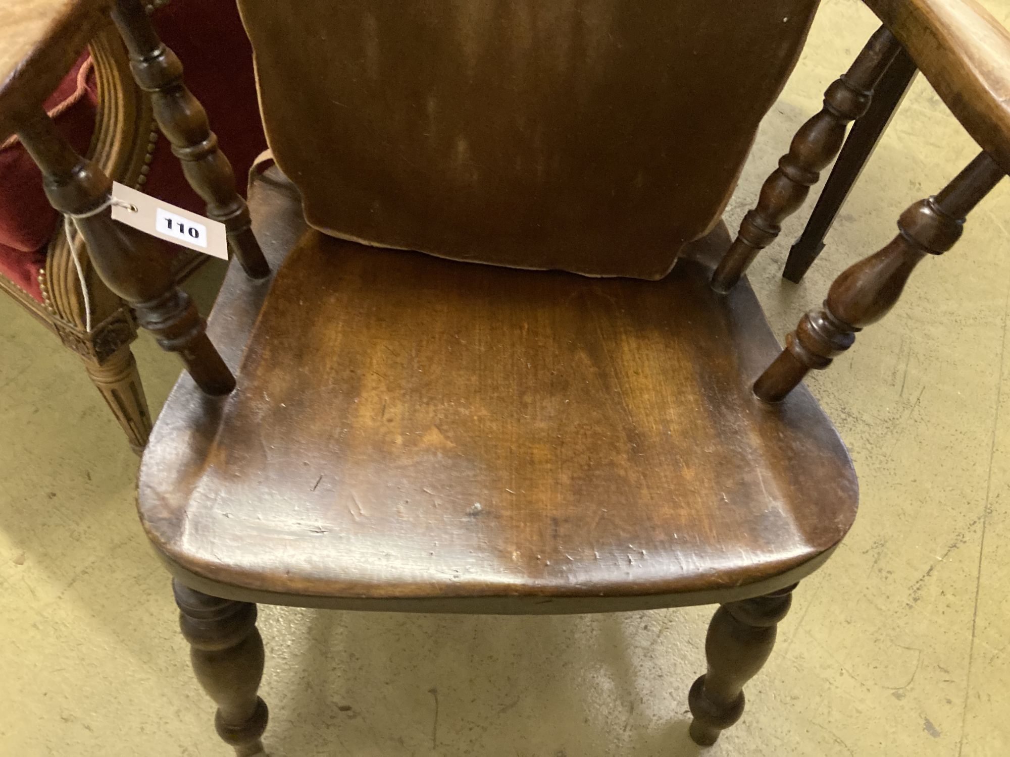 A late Victorian beech smokers bow elbow chair, width 67cm, depth 48cm, height 82cm